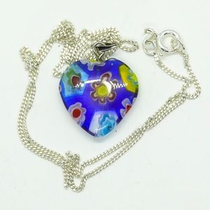 Glass pendant with sterling silver chain.